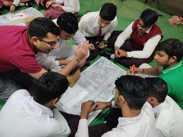 WRI India team member interacting with students at Swami Nitanand School, Rohtak. 