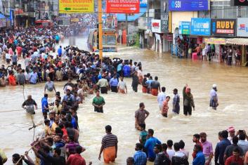 People gather to rescue the affected people from flooded areas of Pathanamthitta in Kerala. Photo by AJP/Shutterstock. People gather to rescue the affected people from flooded areas of Pathanamthitta in Kerala. Photo by AJP/Shutterstock.